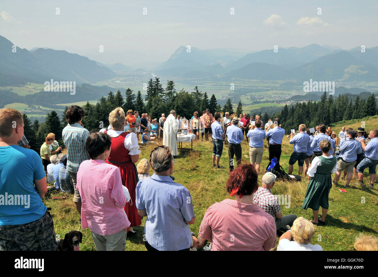 Moutain mass and church service over the Inn Valley, Bavaria, Germany Stock Photo