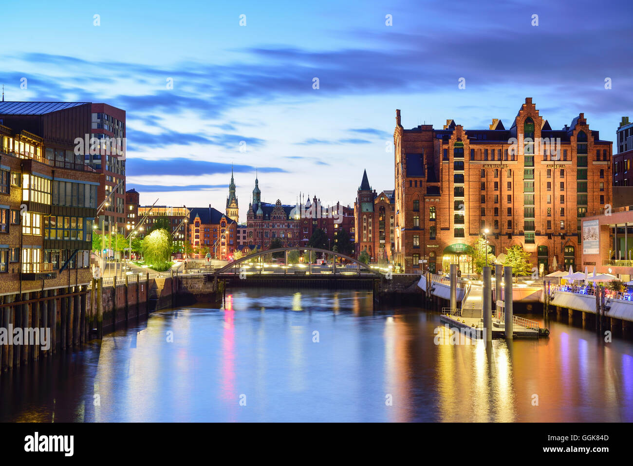 Illuminated port Magdeburger Hafen with warehouse district in background, Hafencity, Hamburg, Germany Stock Photo