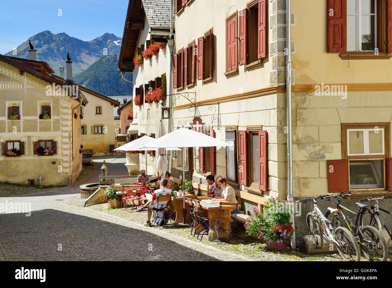 Guests in a pavement cafe, Guarda, Lower Engadin, Canton of Graubuenden, Switzerland Stock Photo