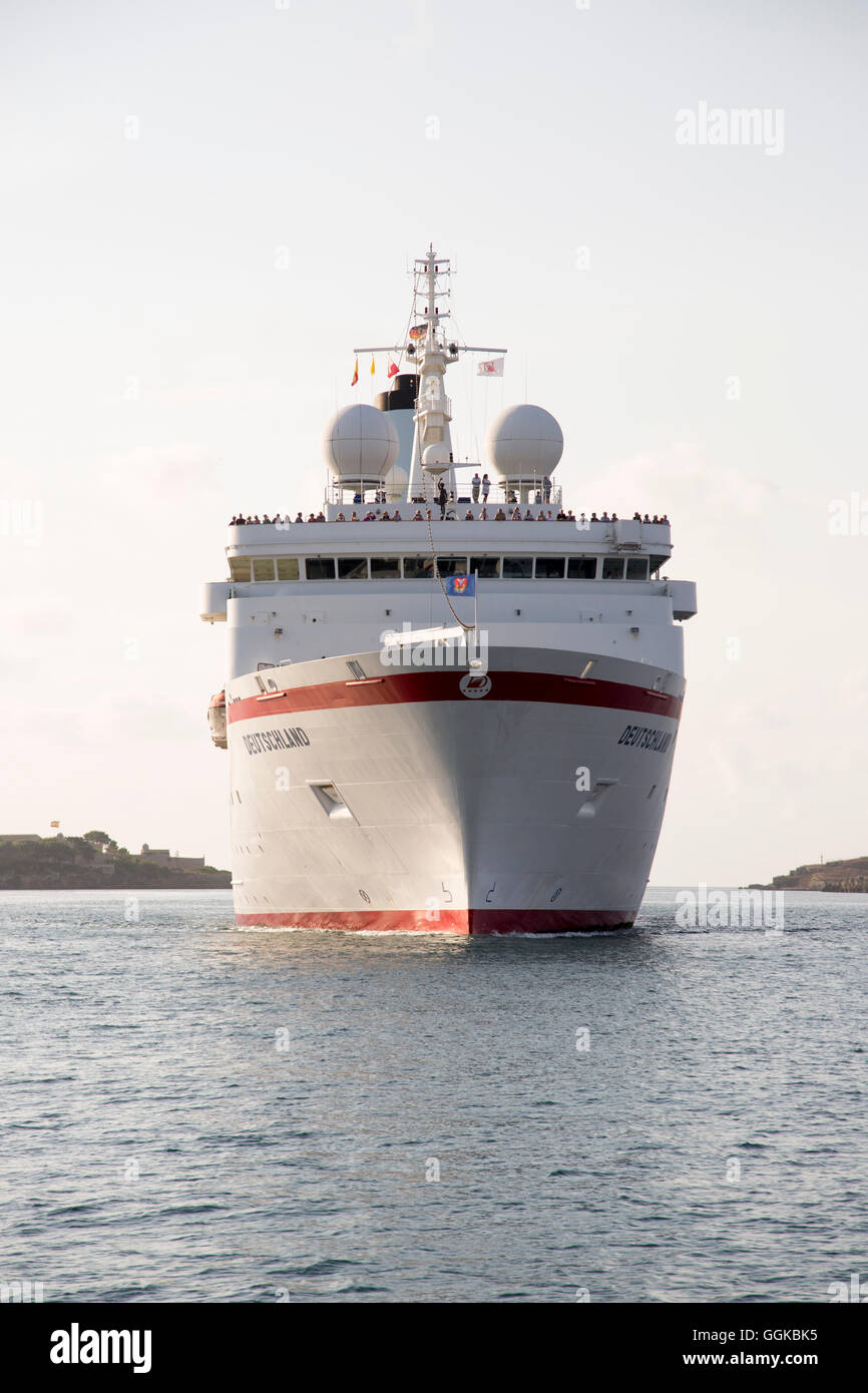 Cruise ship MS Deutschland (Reederei Peter Deilmann) sailing into Mahon harbour, Mahon, Menorca, Balearic Islands, Spain Stock Photo