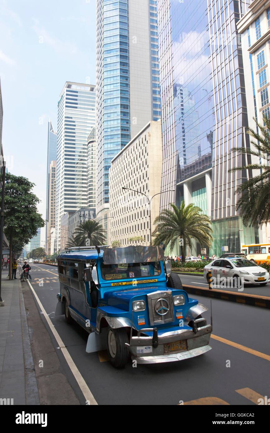 Jeepney typical phillipine public transport, Ayala Avenue in Makati City, the financial and business district in the center oft Stock Photo