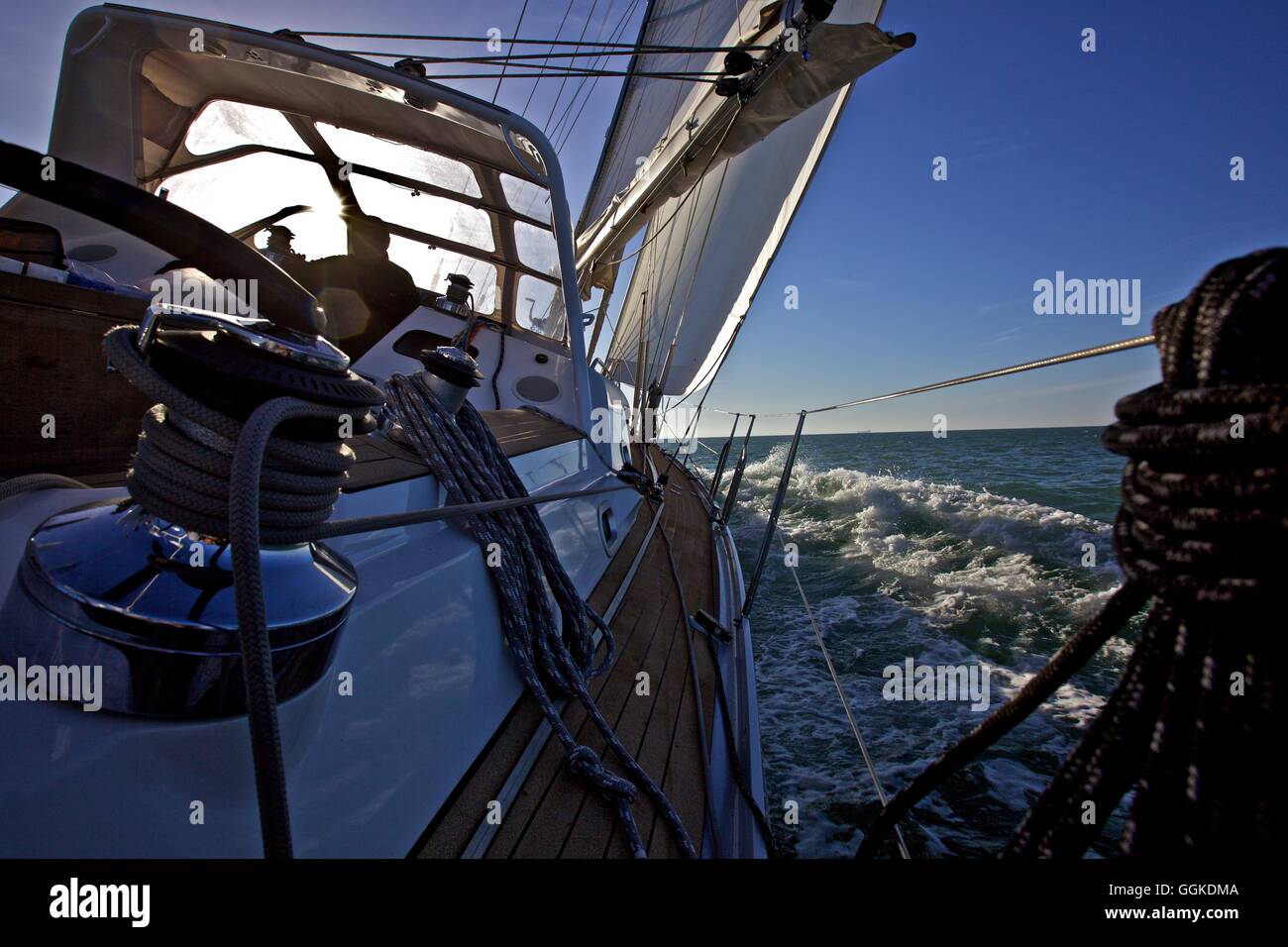 Heeling sailing boat on the sea Stock Photo