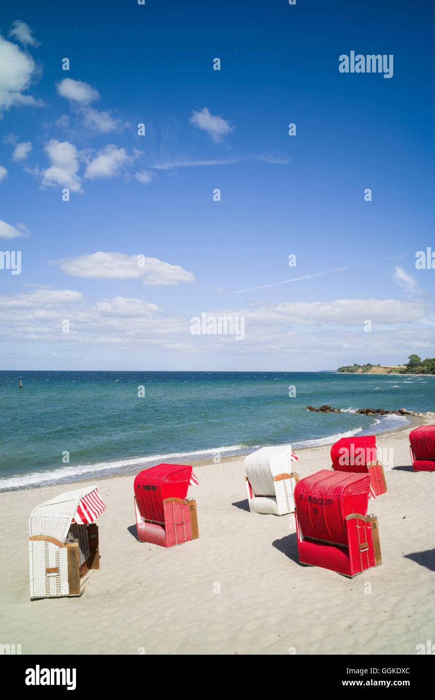 Roofed wicker beach chairs at beach on the Baltic Sea, Brodtener Ufer, Schleswig-Holstein, Germany Stock Photo