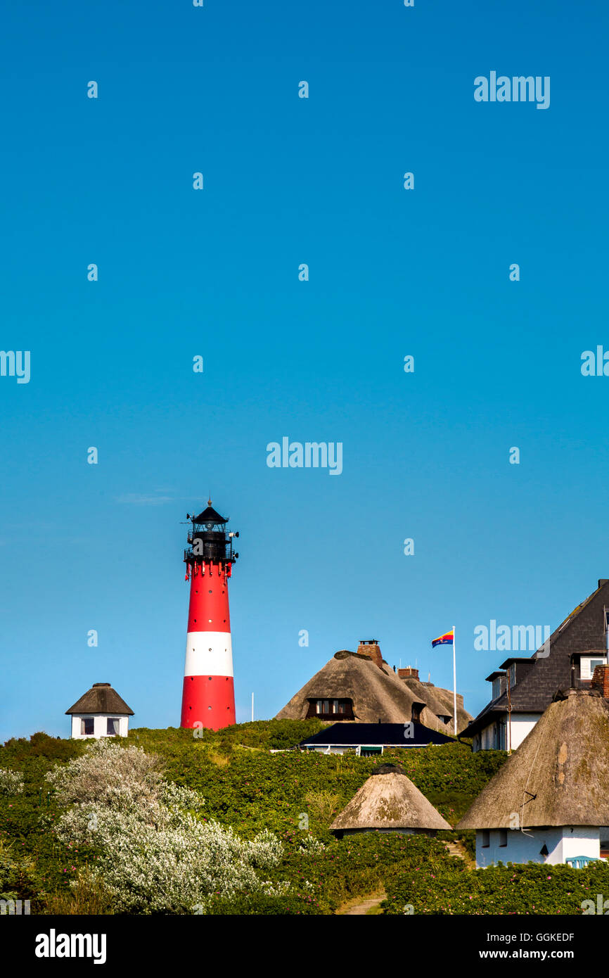Thatched houses and lighthouse, Hoernum, Sylt Island, North Frisian Islands, Schleswig-Holstein, Germany Stock Photo