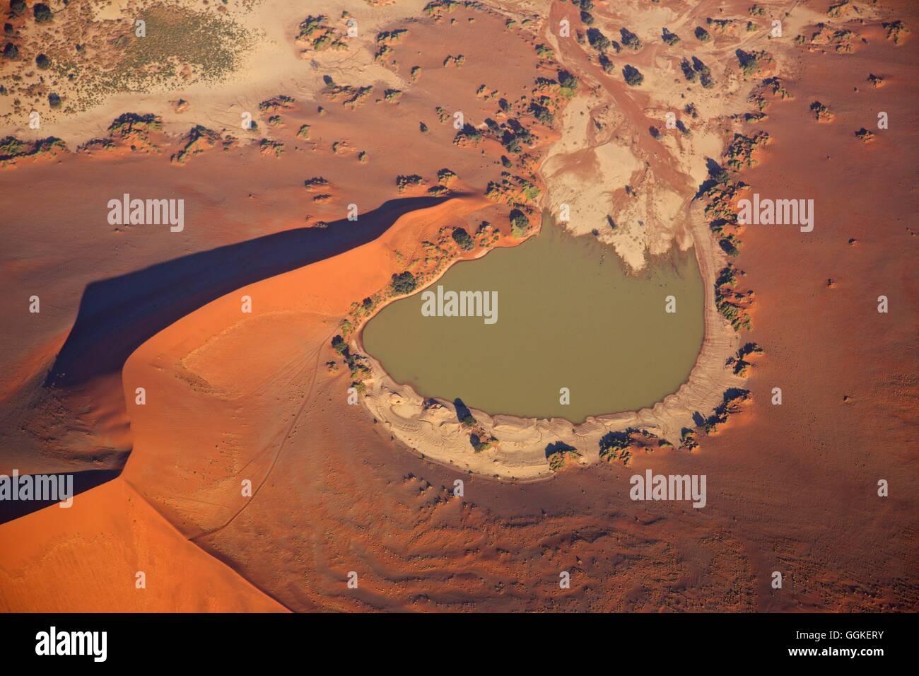 aerial shot of a clay pan at Sossusvlei filled with water, Namibia Stock Photo