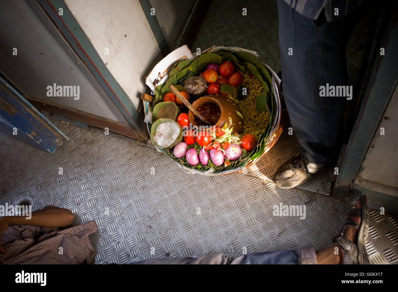 Food vendor on a second class passengers local train in Haridwar, India. © Jordi Boixareu Stock Photo