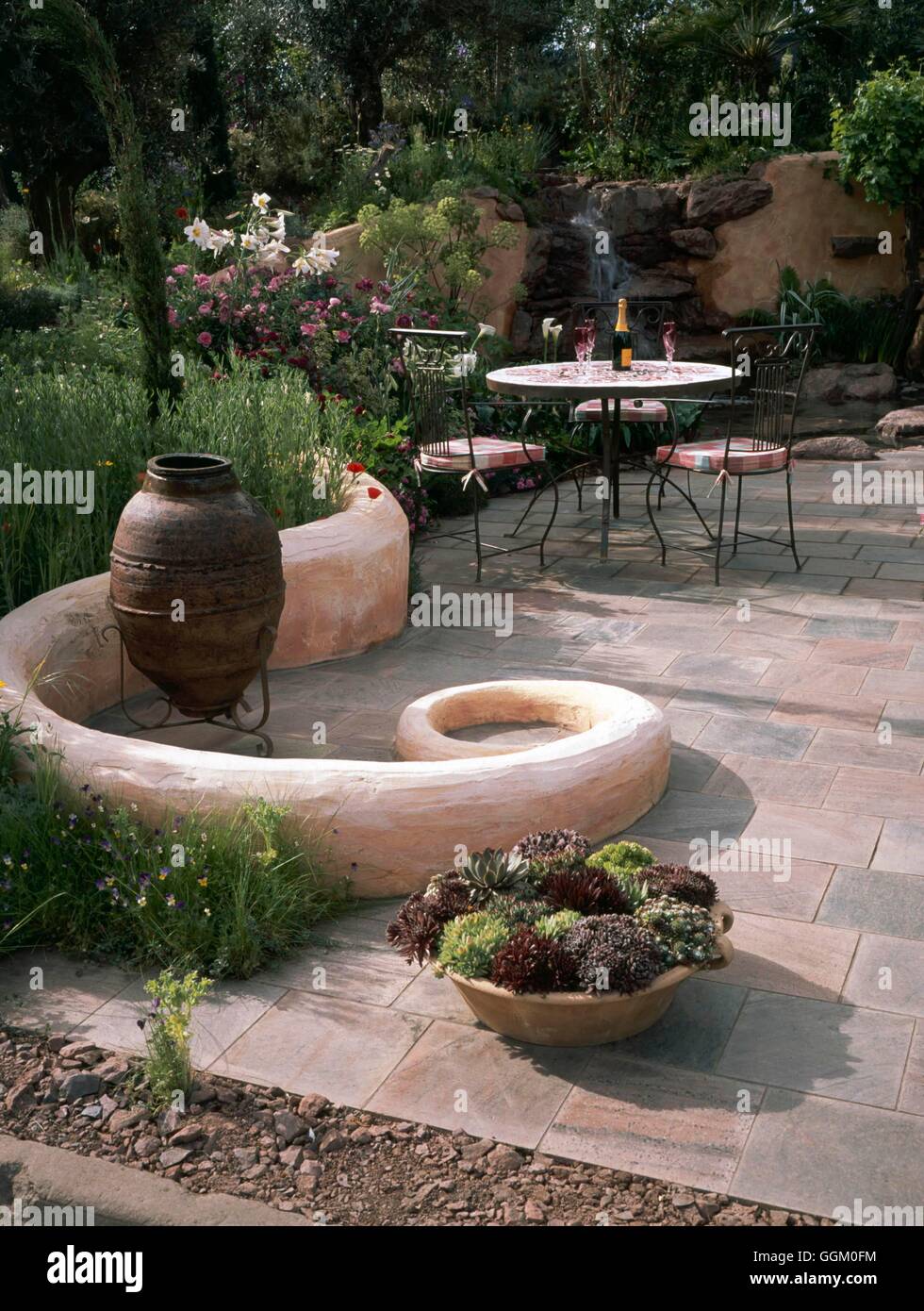 Patio- in mediterranean style garden- - (Please credit: Photos Hort/designer Marney Hall)   MIW253663  Compulsory Cred Stock Photo