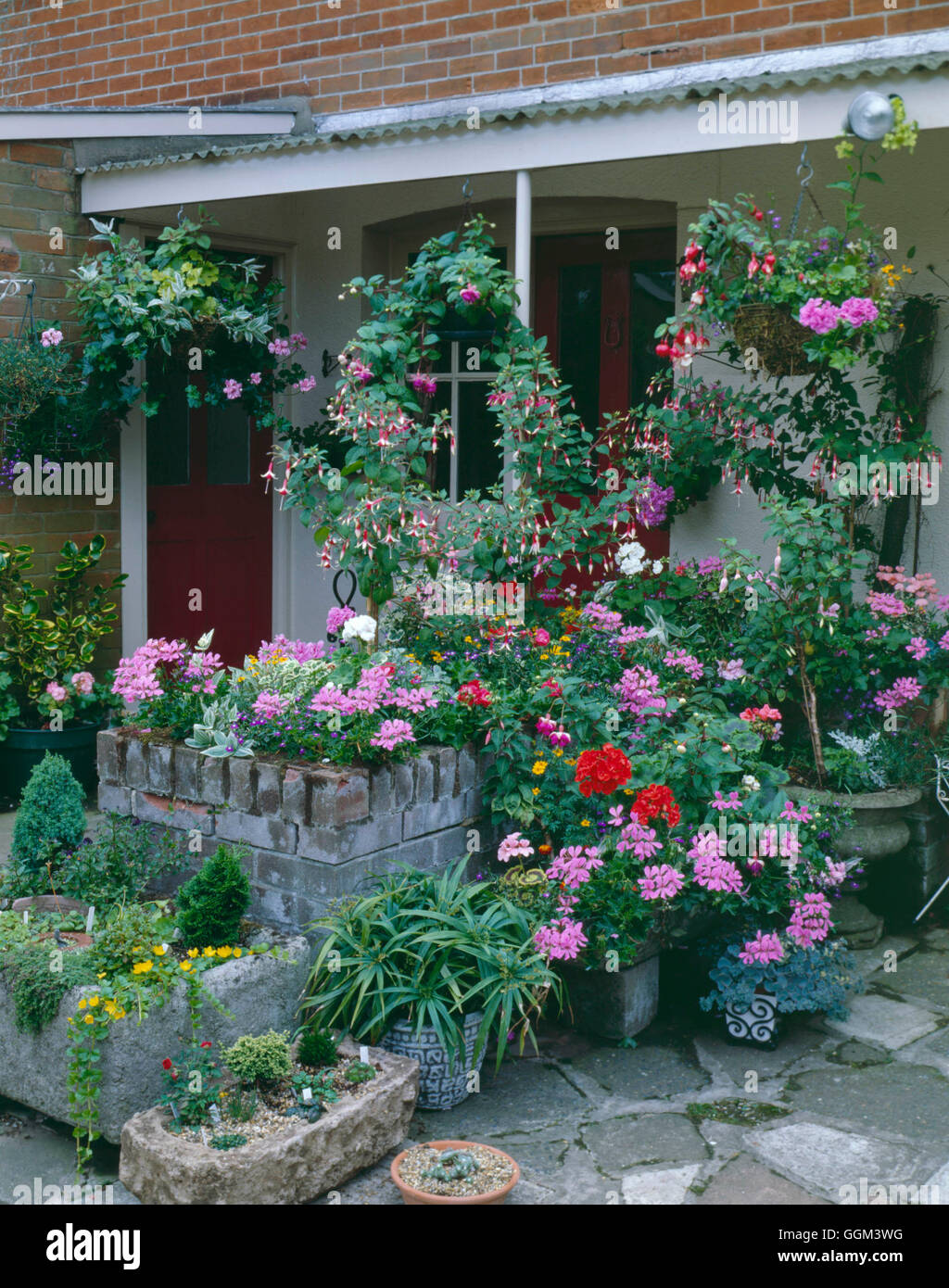 Patio  House and Surround - enhanced with containers of Annuals   PHS103359 Stock Photo