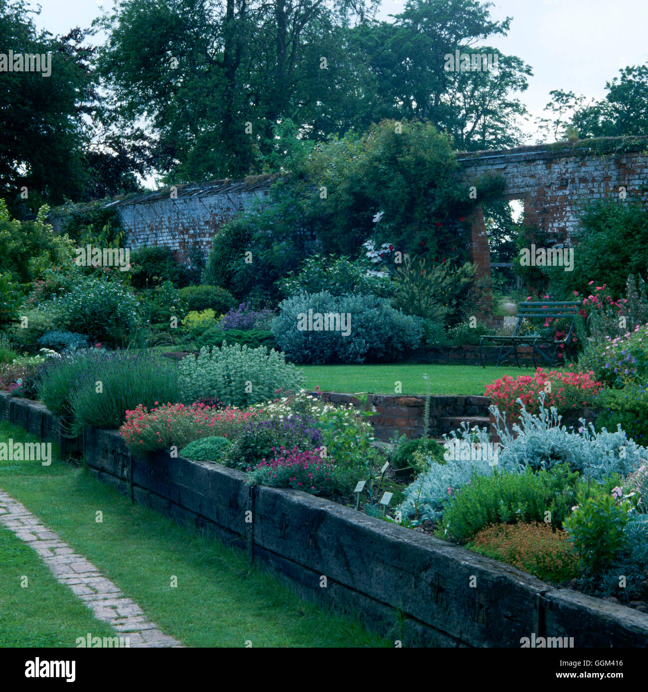 Raised Beds Constructed From Railway Sleepers Stone House Cottage Stock Photo Alamy