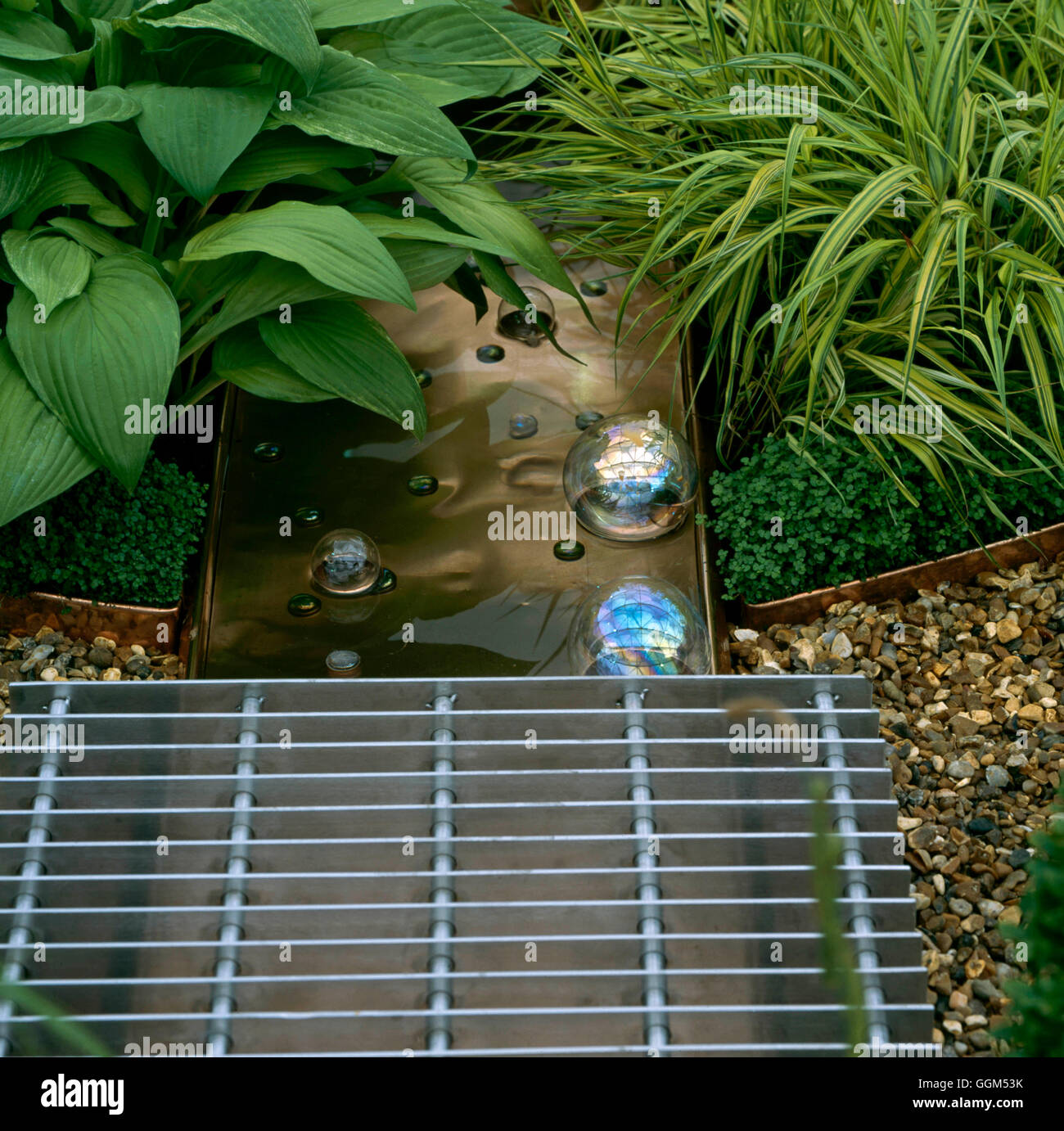 Stepping Stones - Grill over water feature (Please credit: Photos Hort/Chelsea FS 2002)   STS105389  Compulsory Credit Stock Photo