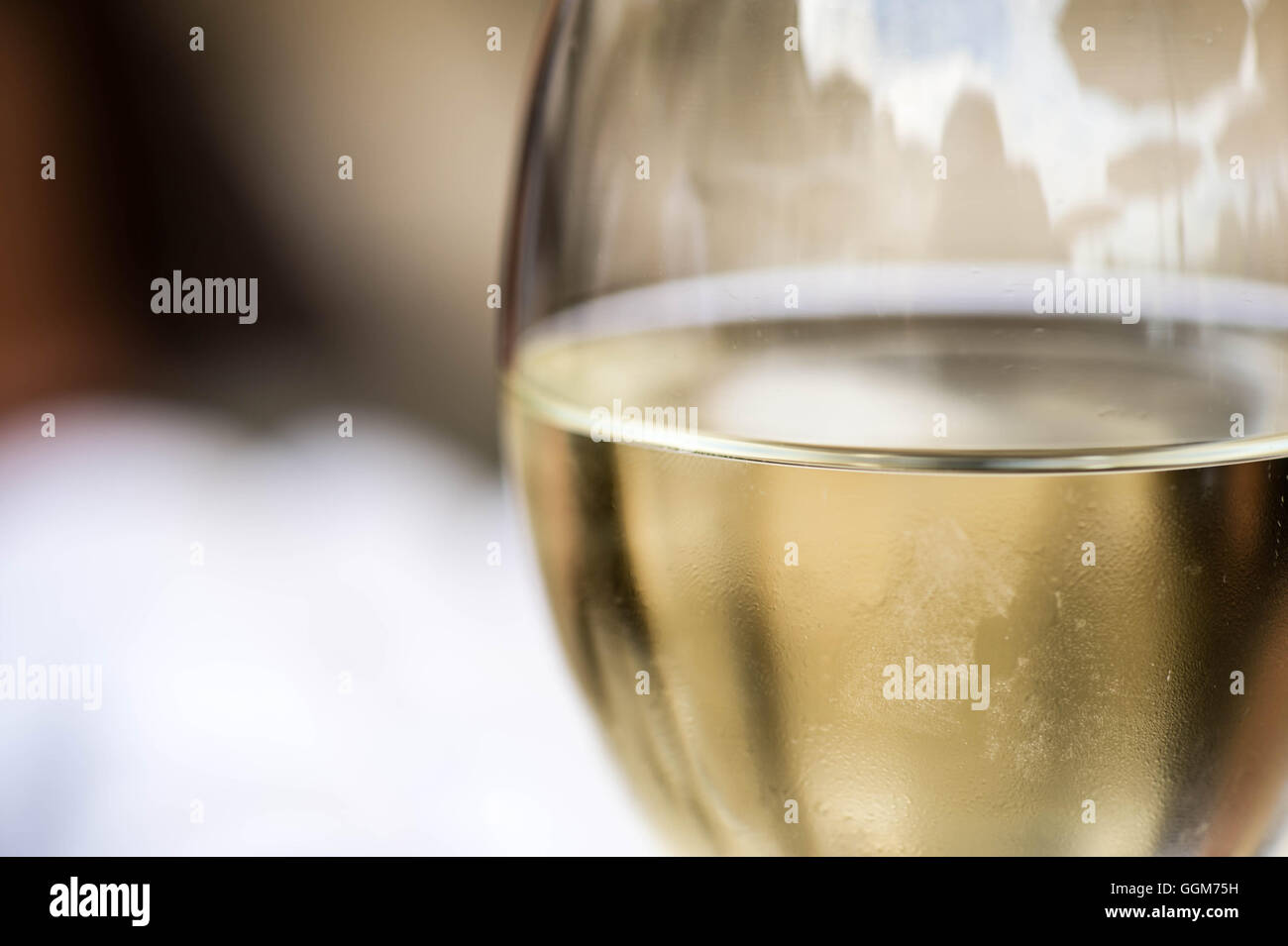 Close Up Of A Glass of White Wine With Copy Space Stock Photo