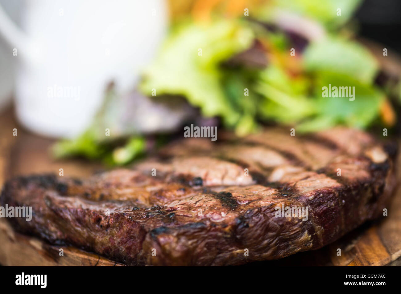 Succulent Grilled Fresh Fillet Of Ribeye Beef Steak Served With A Green ...
