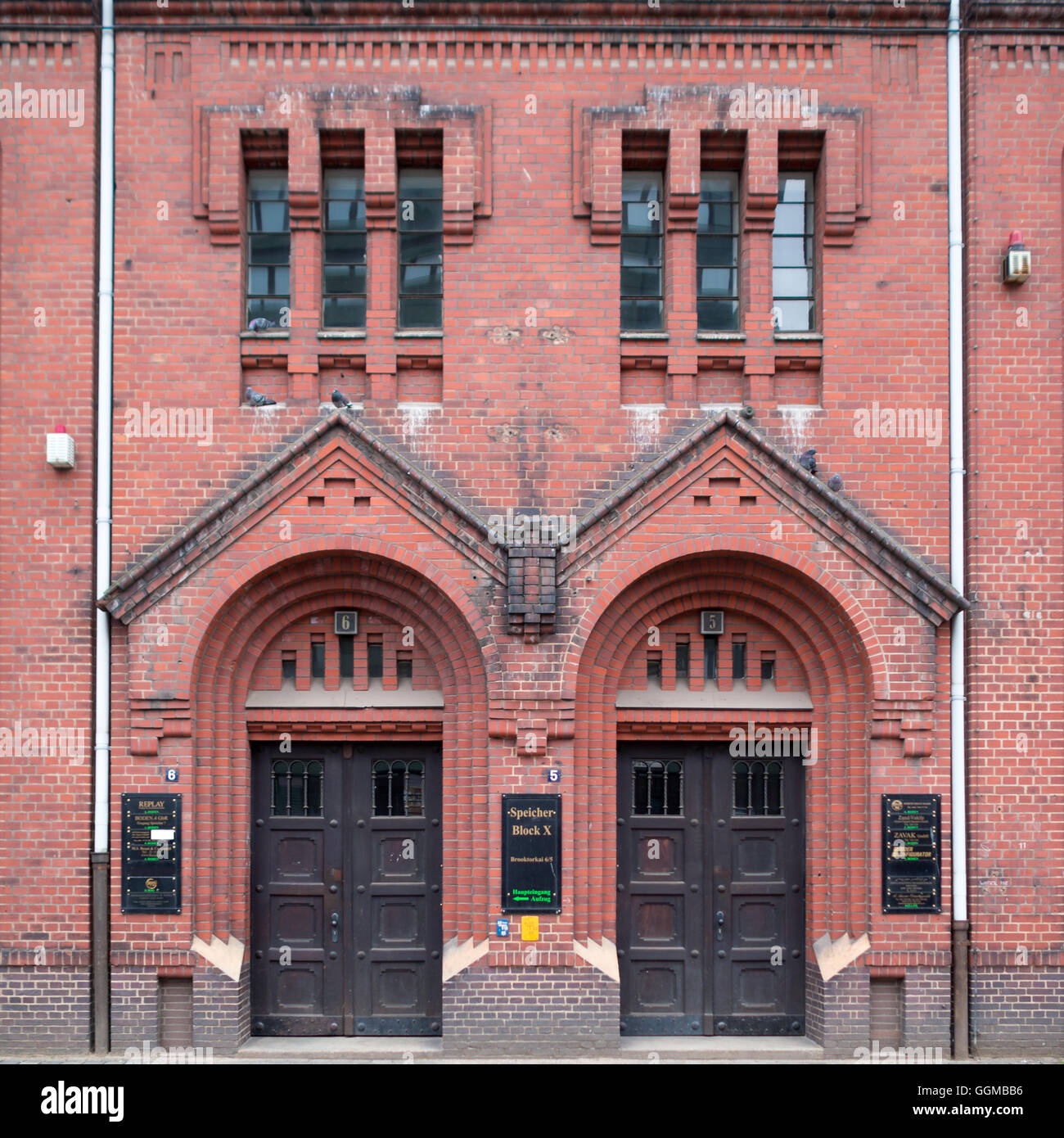 Symmetrical door in a red brick facade of an Hafen City building Stock Photo