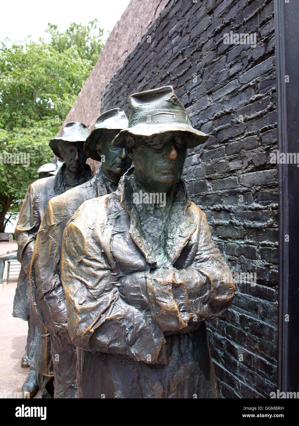 statues of unemployed men standing in a bread line during the Great Depression at the FDR Memorial in Washington, D.C. Stock Photo
