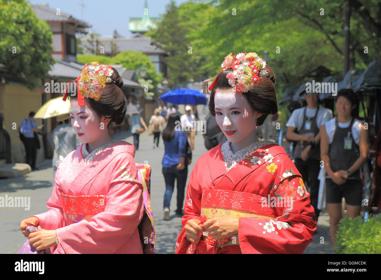 Geisha girls pose for photos in Higashiyama in Kyoto Japan. Stock Photo
