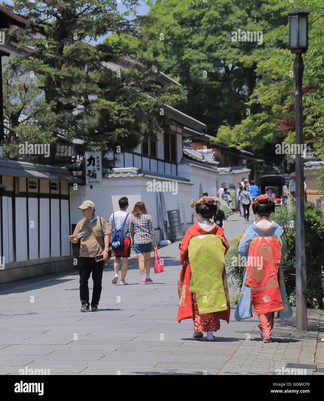 Geisha girls walk on street in Higashiyama in Kyoto Japan. Stock Photo
