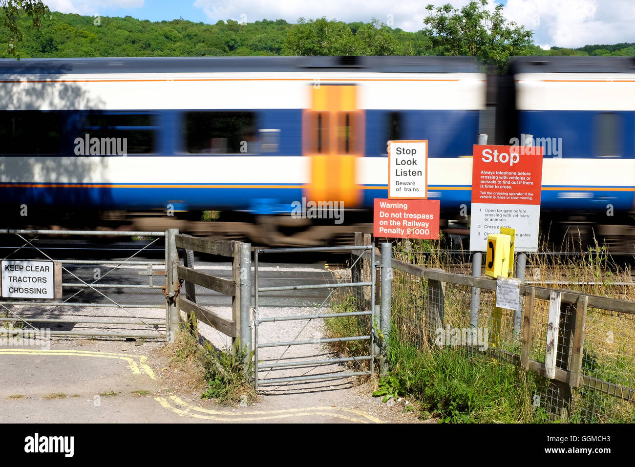 A train passing through an unmanned, non-automatic railway crossing near Bath, England. Stock Photo