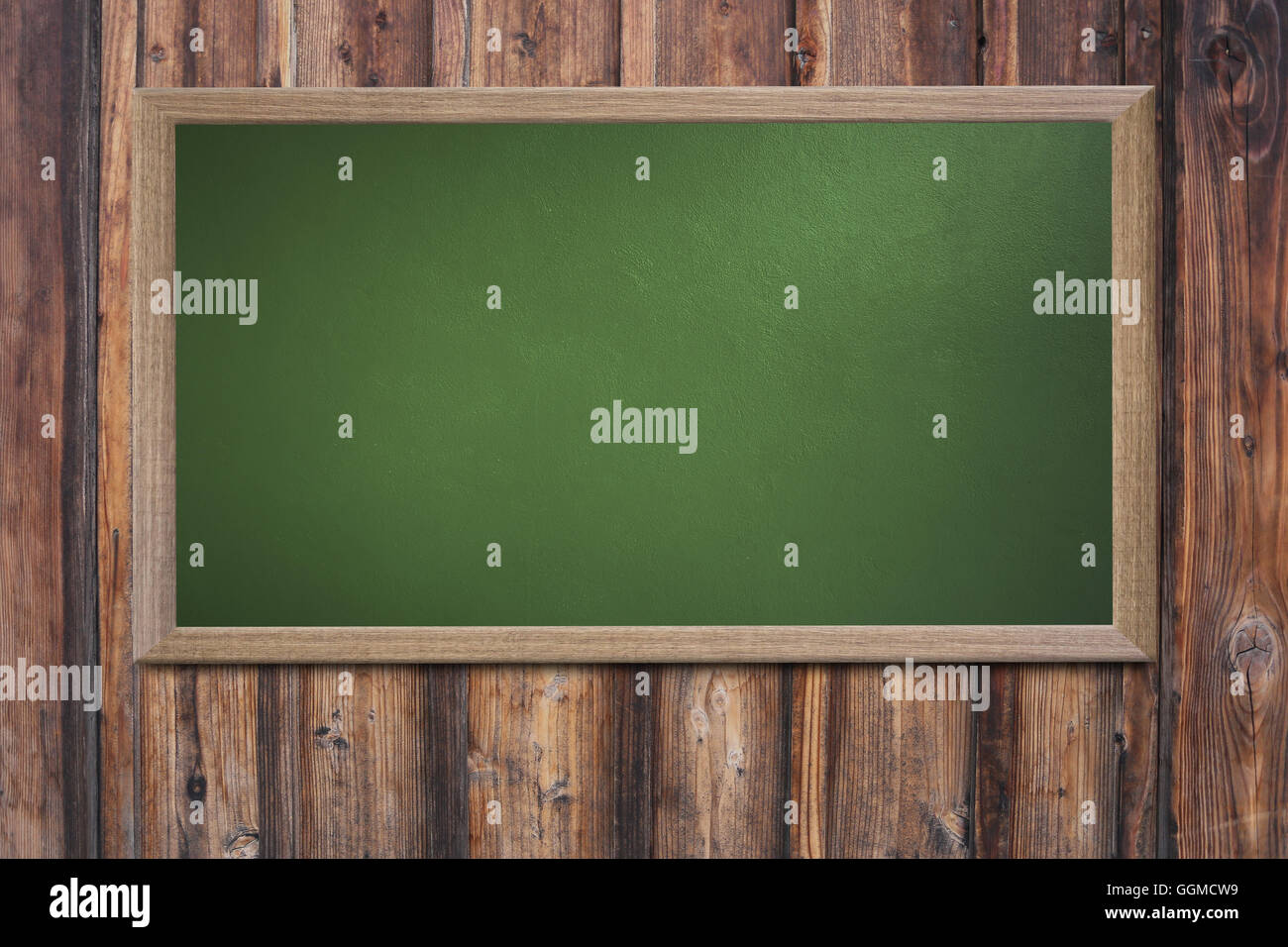 Blank old school blackboard on a grunge wall and can input text or data to wooden frame for concept of education. Stock Photo