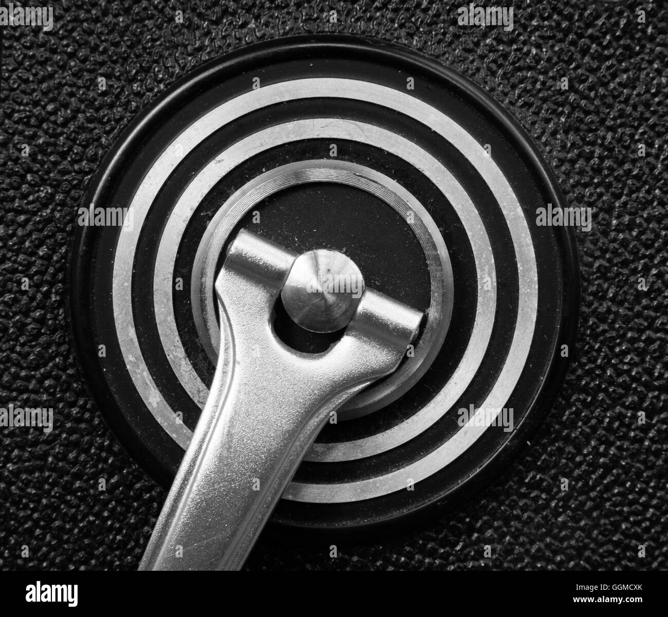 Metal wheel close up, machinery symbol and concept of work and charge, old black and white Stock Photo