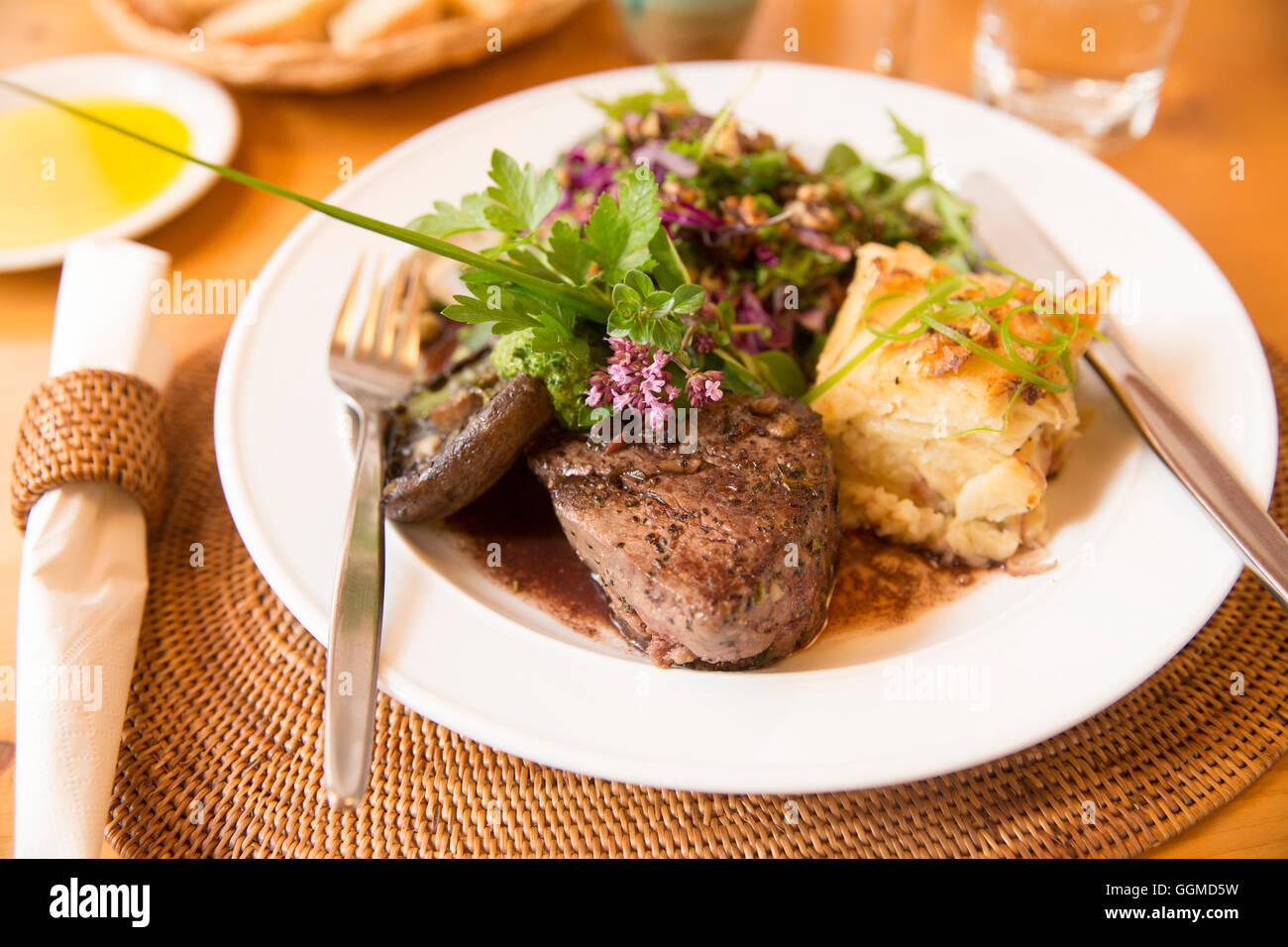 A steak at Sans Souci Inn, prepared by the hosts Vera and Reto Balzer, Sans Souci Inn, Pohara, South Island, New Zealand Stock Photo