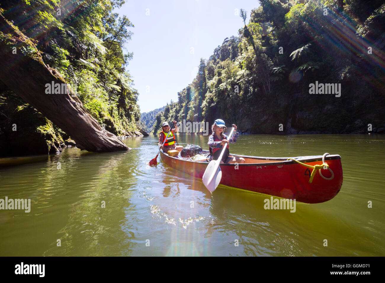 A girl and a woman on a canoe trip on the Whanganui River, North Island, New Zealand Stock Photo