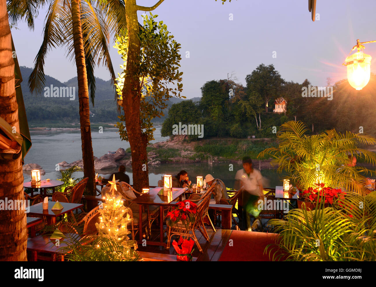 Restaurant along the mekong river and river Nam Khan, Luang Prabang, Laos, Asia Stock Photo