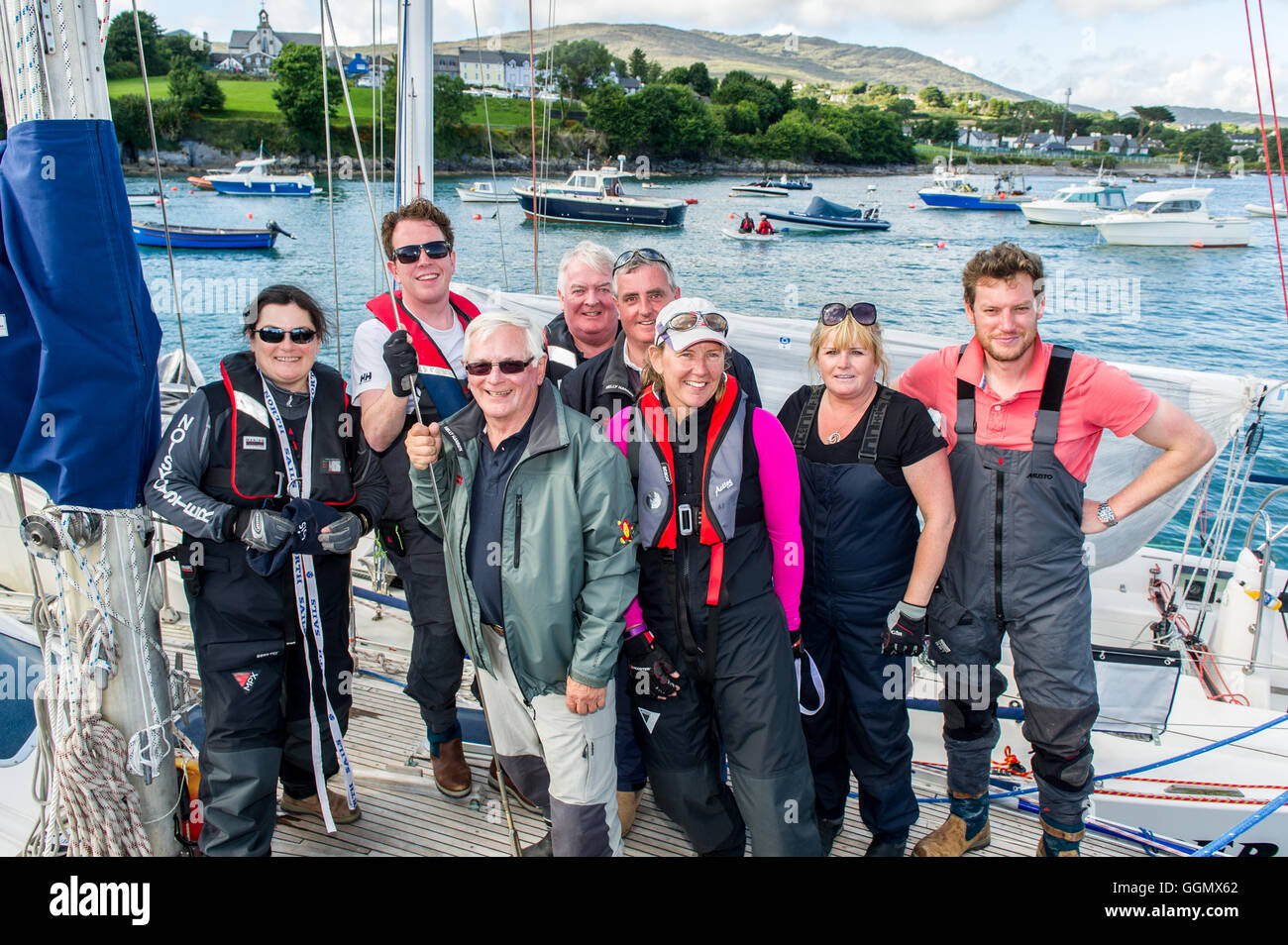Schull, Ireland. 5th Aug, 2016.  On a very hot day during the annual Schull Regatta, the crew of Dublin based boat 'Powder Monkey', skippered by Chris Moore, Commodore of Dublin Bay Sailing Club , pose for the camera after finishing 4th in one of the Regatta races. The Regatta runs until Sunday, culminating in a firework display on Sunday night. Credit: Andy Gibson/Alamy Live News. Stock Photo