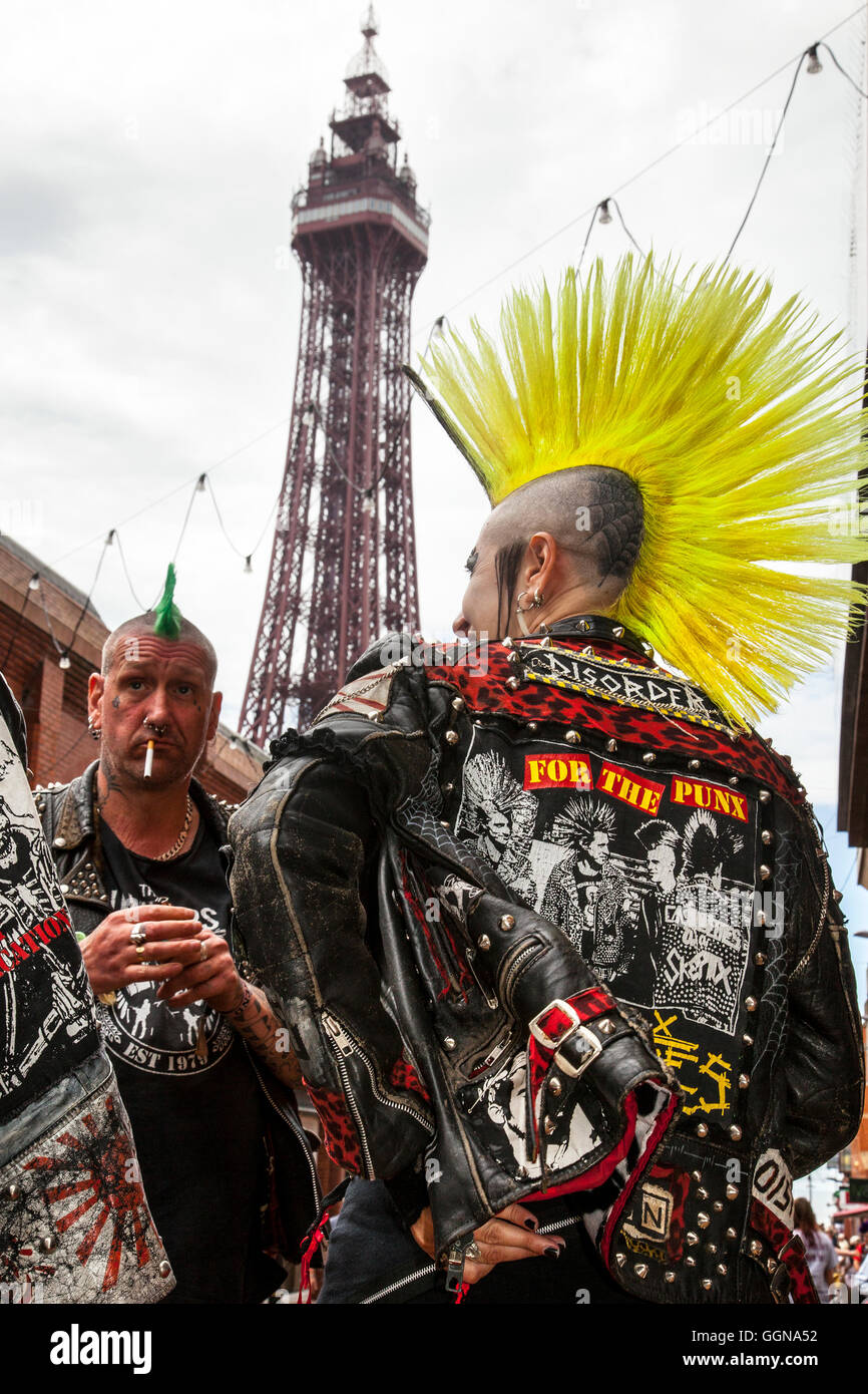 Blackpool, Lancashire, UK. 6th August, 2016. 20th anniversary Rebellion fest returned to Blackpool Winter Tower Gardens as one of the world’s biggest punk festivals.  Spiky-haired punks gathered at the UK’s biggest alternative music festival. The Rebellion Festival sees hard rocking punk bands take to the stage at Blackpool’s Winter Gardens every year to the delight of cheering crowds. The resort’s streets are painted every colour of the rainbow as lifelong punk fans with vividly dyed Mohawks, leather jackets and plaid trousers flock to the resort. Credit:  MediaWorldImages/Alamy Live News Stock Photo