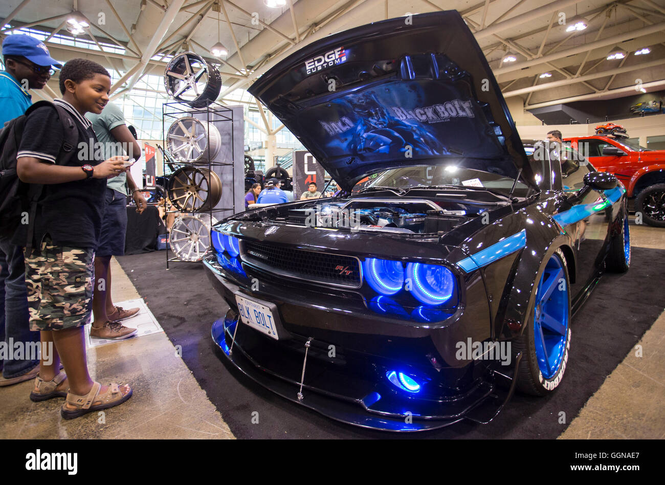 Toronto, Canada. 6th Aug, 2016. Visitors watch a tuned car during the