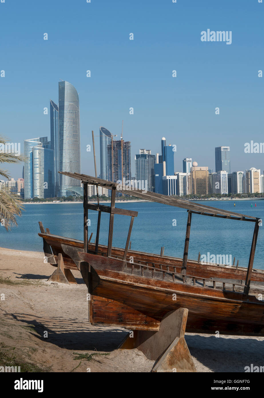 Wooden boats at urban waterfront, Abu Dhabi, Abu Dhabi Emirate, United Arab Emirates, Stock Photo