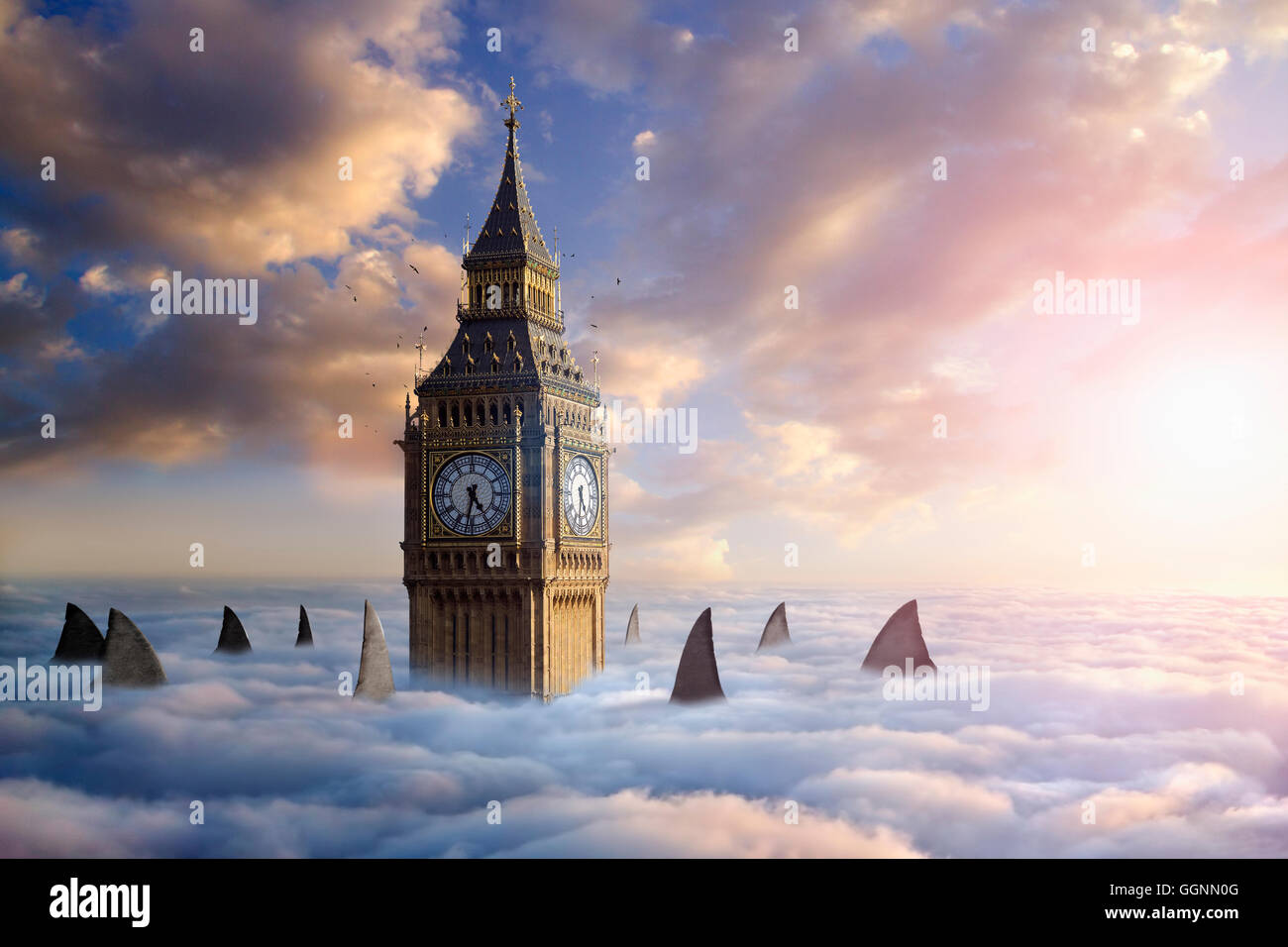 Shark fins and birds circling clock tower above clouds Stock Photo