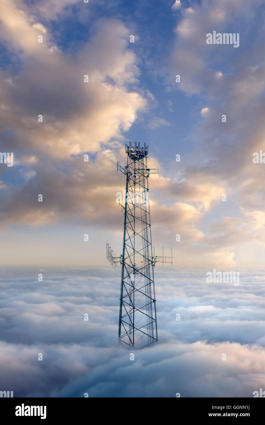 Cellular tower above clouds Stock Photo