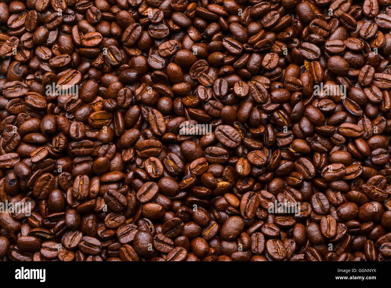Pile of brown roasted coffee beans Stock Photo
