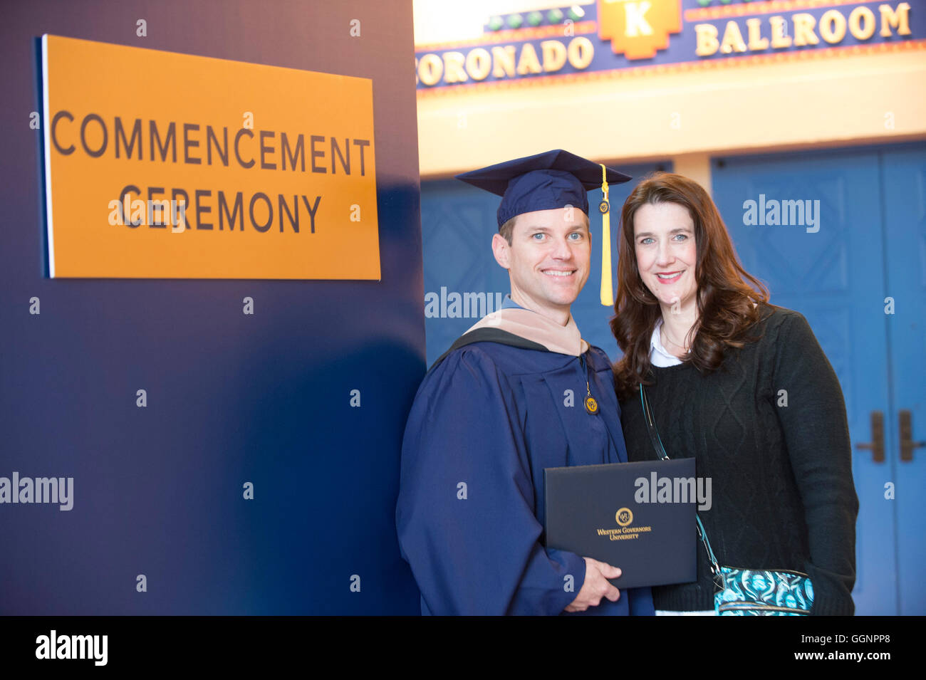 Graduate of Western Governors University poses with friend after
