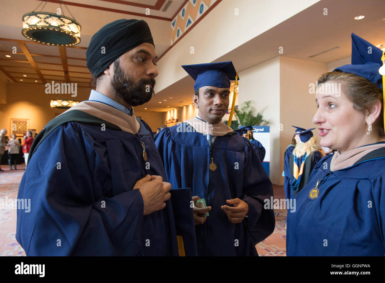 Graduation candidates in caps and gowns wait for Western Governors