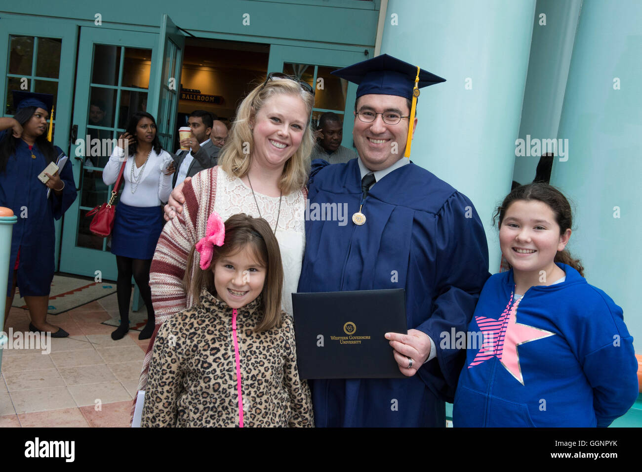 Family celebrates with graduate after commencement for Western