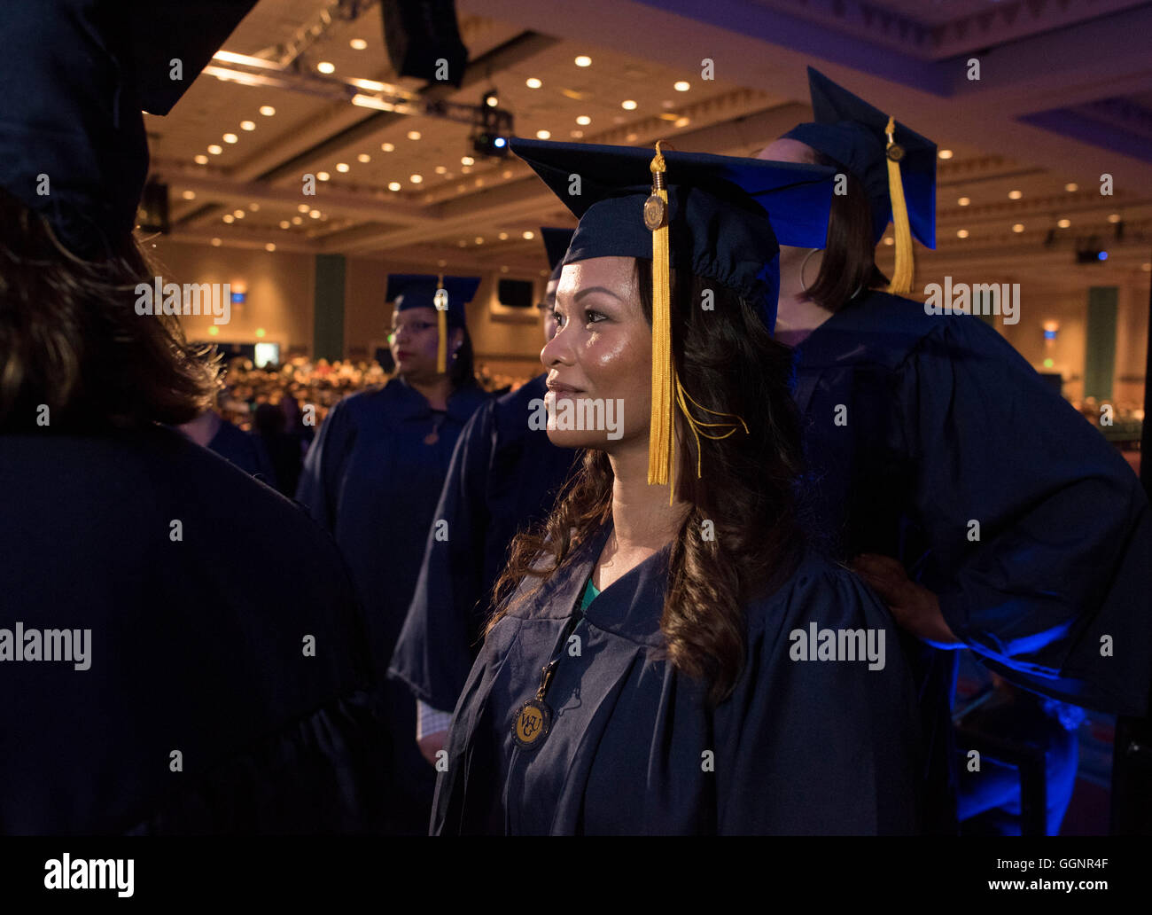 Student waits to receive diploma at commencement ceremony for Western