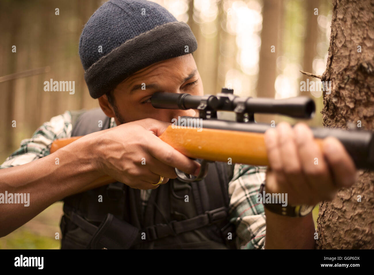 Interracial hunter in the forest Stock Photo