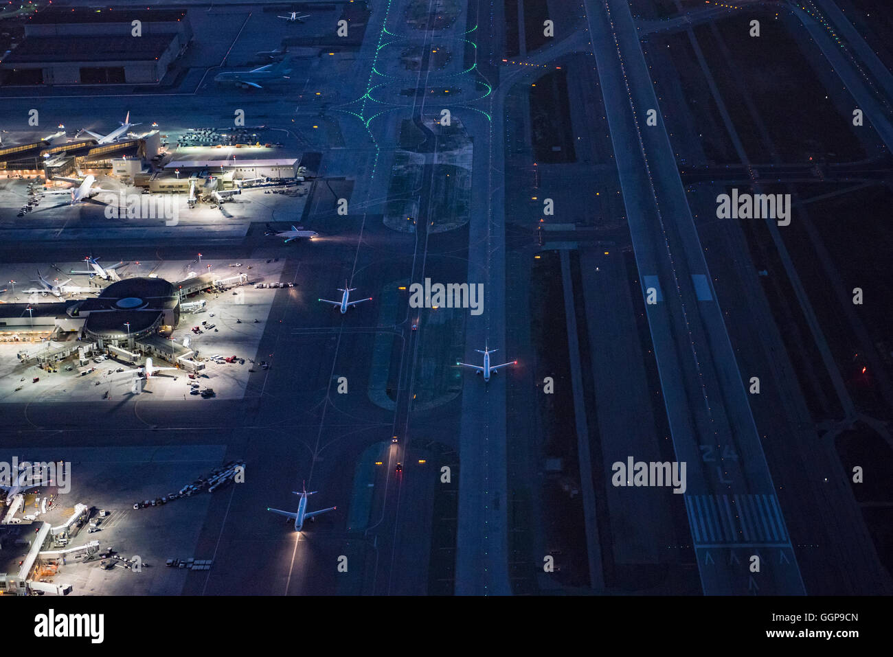 Aerial view of airplanes taxing on airport runway Stock Photo