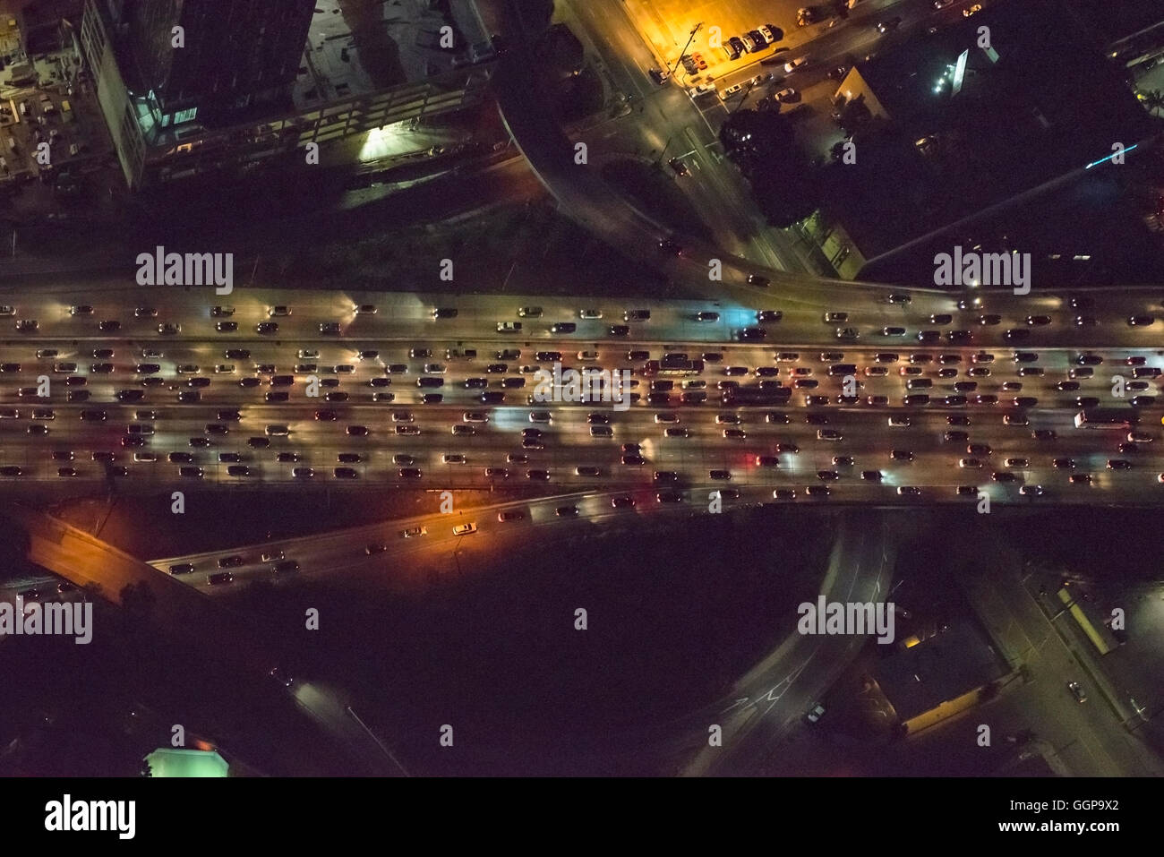 Aerial view of urban highway lit up at night Stock Photo