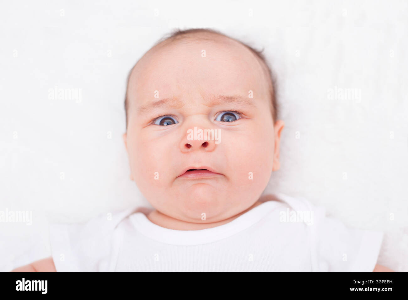 Scared crying baby, alone, in his crib Stock Photo Alamy