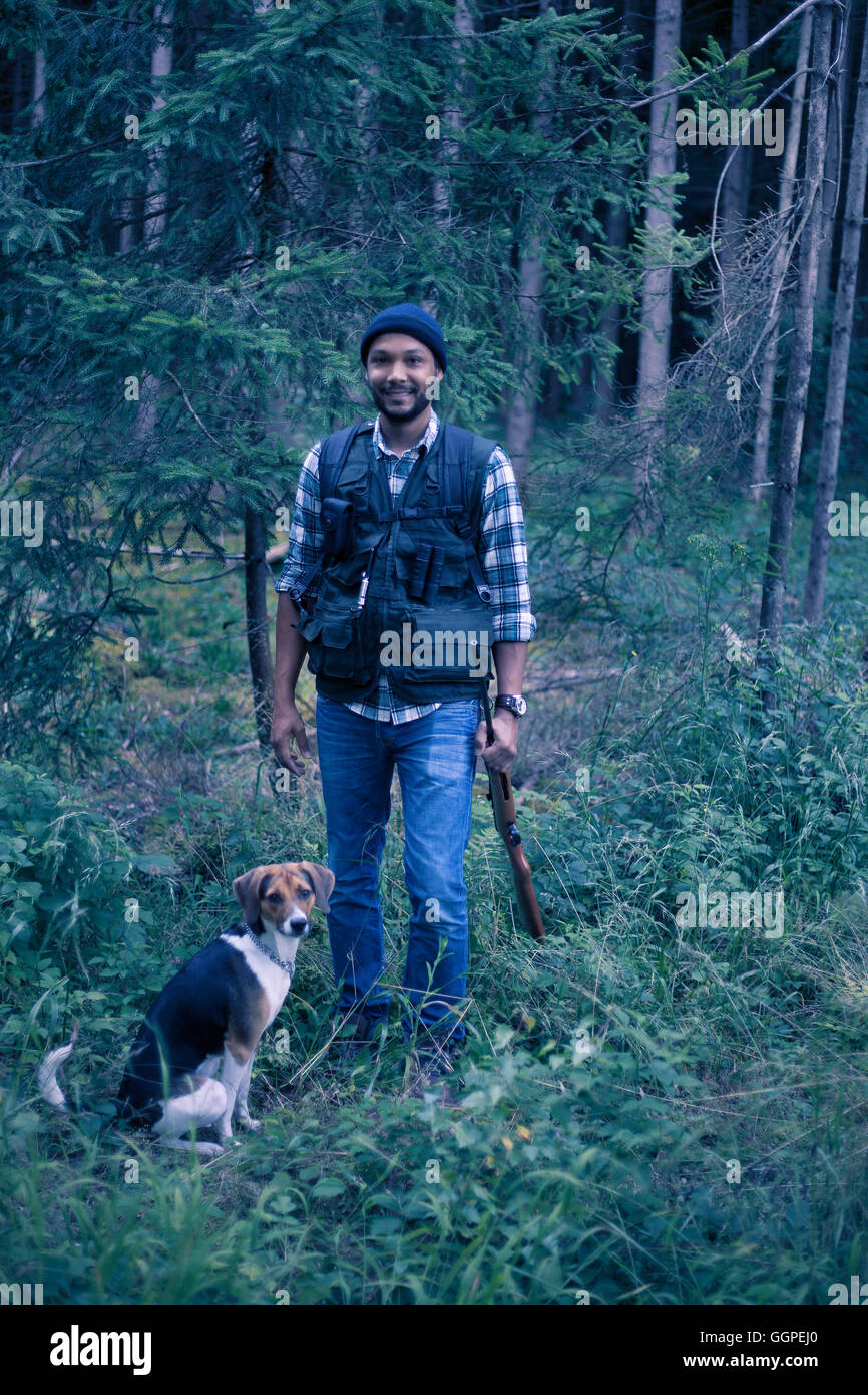 Interracial hunter in the forest Stock Photo