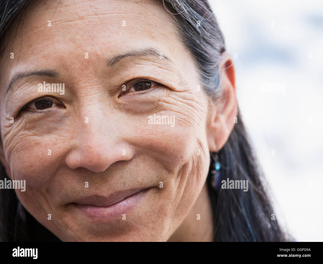 Close up of face of smiling Japanese woman Stock Photo