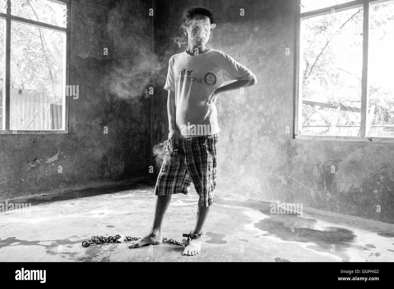 Yohanes Angsel, 33, suffers from mental illness and been chained to the floor of a room in his parents house since 2004. According to Human Rights Watch there are at least 18,800 people currently being shackled in Indonesia due to mental illness. Family members say relatives are shackled or chained up to prevent them from doing harm to themselves. Also, it's often the case that people in rural areas don’t have the facilities or know how to care for the mentally ill. Stock Photo