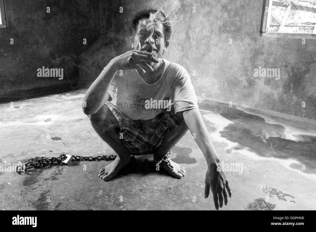 Yohanes Angsel, 33, suffers from mental illness and been chained to the floor of a room in his parents house since 2004. According to Human Rights Watch there are at least 18,800 people currently being shackled in Indonesia due to mental illness. Family members say relatives are shackled or chained up to prevent them from doing harm to themselves. Also, it's often the case that people in rural areas don’t have the facilities or know how to care for the mentally ill. Stock Photo