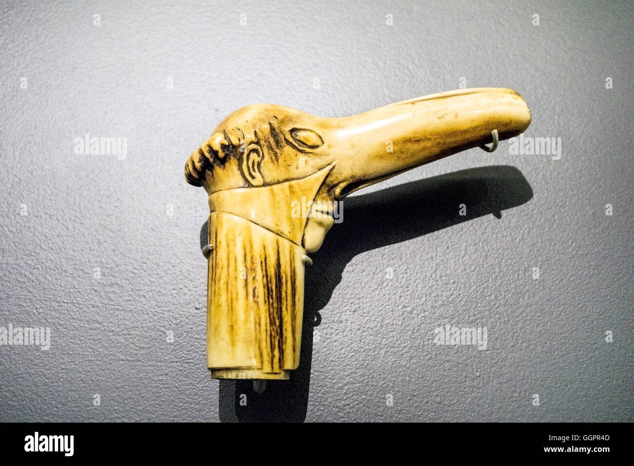 ivory cane handle carved in cruel satire of long nosed old Jew displayed among artifacts revealing virulence of Nazi propaganda Stock Photo