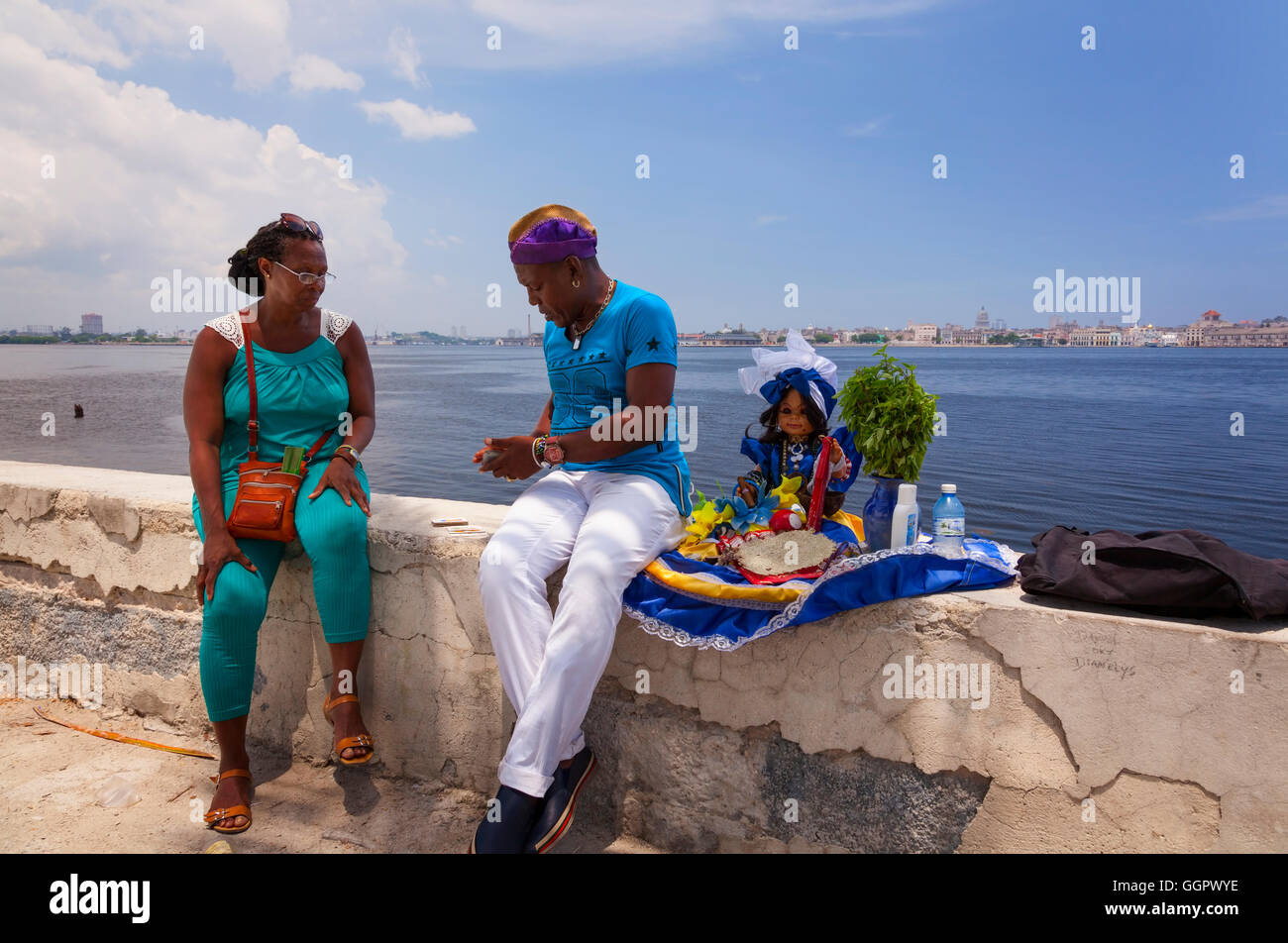 A tarot card reading by an Afro-Cuban, which is part of the Santeria religion. Regla, Havana, Cuba. Stock Photo