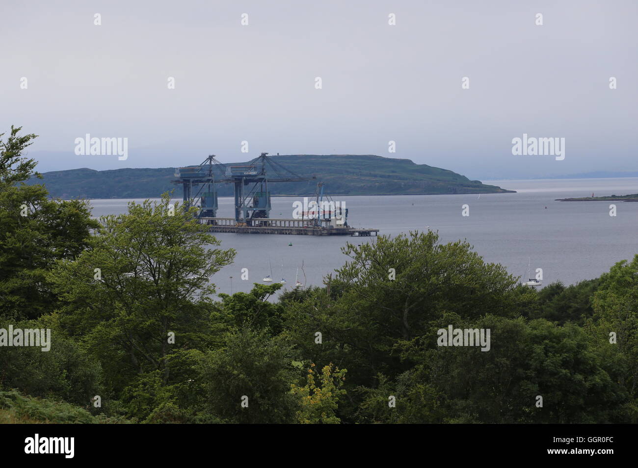 Cranes at Hunterston Terminal near Fairlie and Little Cumbrae Island Scotland  August 2016 Stock Photo