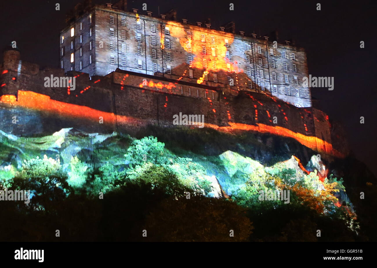 A series of digitally animated projections take place across the western facade of Edinburgh Castle during a photocall of Standard Life Opening Event: Deep Time, at Castle Terrace, Edinburgh, Scotland. Stock Photo