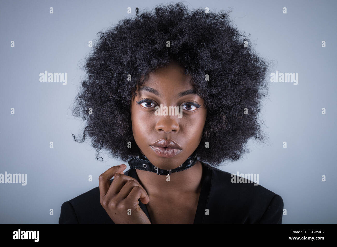 Afro Caribbean woman in her 20s shooting fashion images Stock Photo
